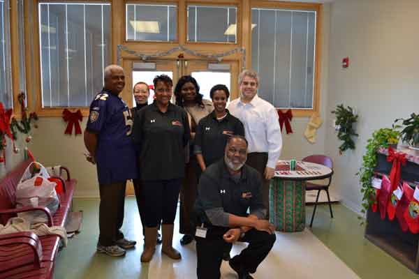 L-R: Occupational & Professional Licensing Commissioner Stanley Botts, Barbara Kittrell, 
                  Maria Simms, Summar Goodman, Kym Nelson and Secretary Alexander M. Sanchez, Kneeling: Gary Holland