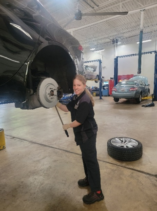 Doria works on a car